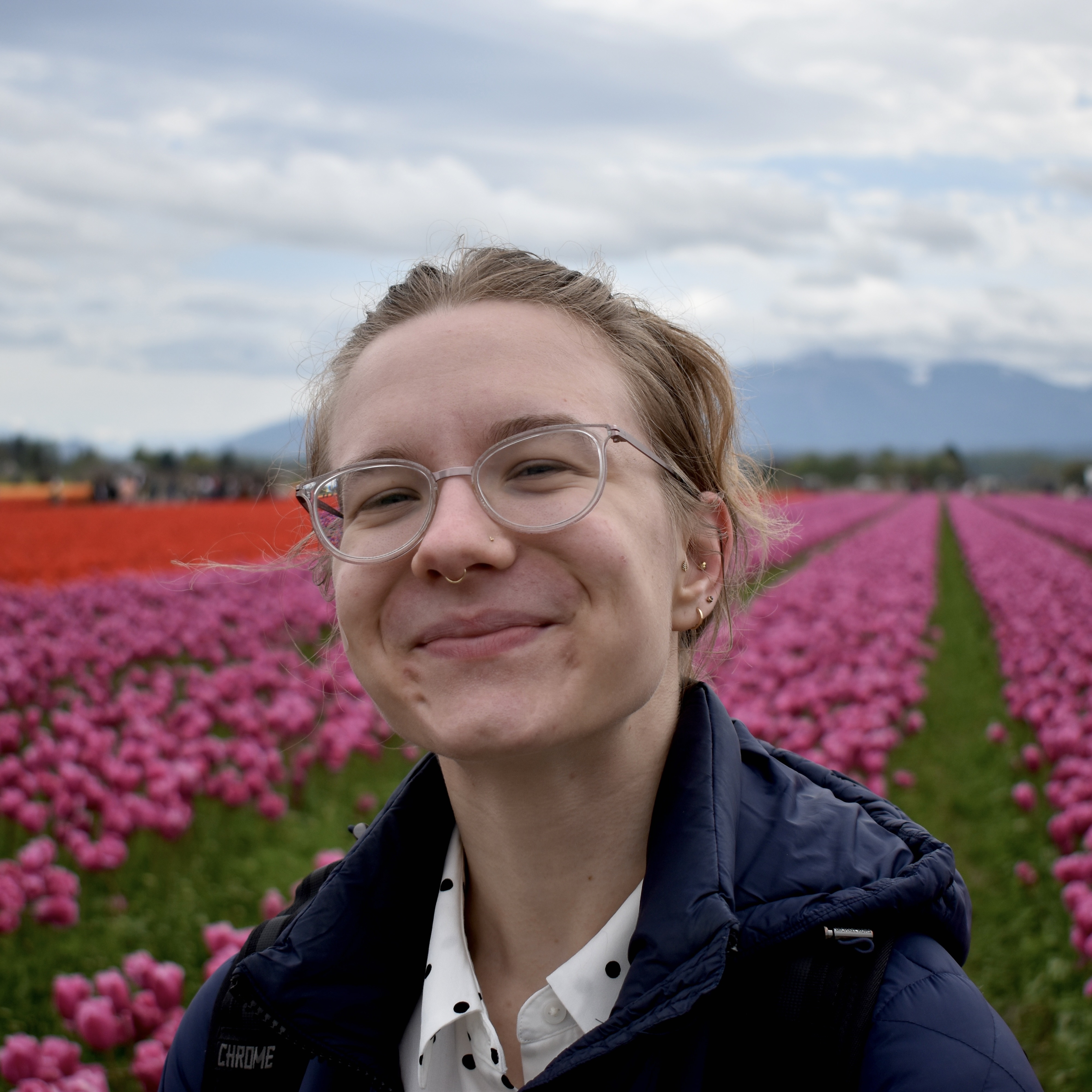 Sasha, smiling at camera outside